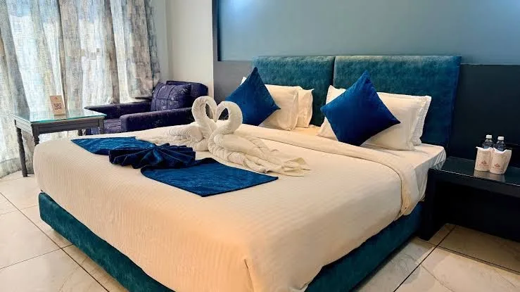 Premium Room with teal velvet bed
